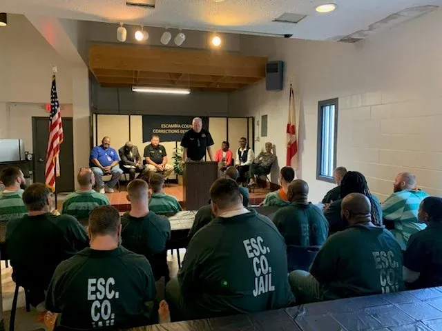 OM Worldwide Inc — Corrections program graduation ceremony